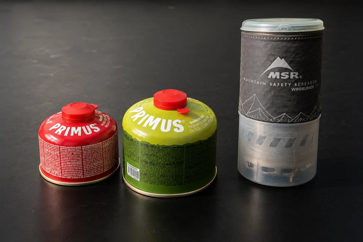 Primus gas canister on the forest floor during a camping trip